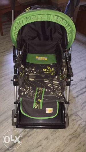 Baby's Black And Green Umbrella Stroller