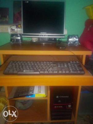 Black Computer Desktop Set On Brown Wooden Computer Table