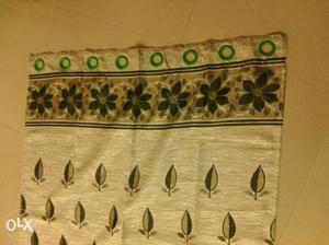 Brand new curtain - 7 ft *4ft. Colour green and half white -
