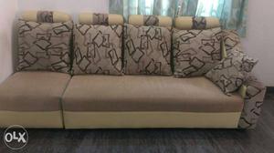 Brown And Beige Couch With Throw Pillows