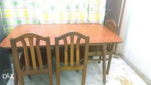 Brown Wooden Table And 6 Chairs