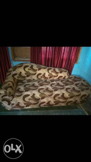 Brown covered wooden couch in excellent