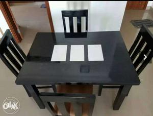 Four Black Wooden Dinning Chairs And Table
