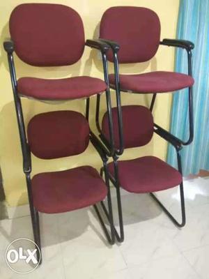 Four Red Padded Cantilever Chairs