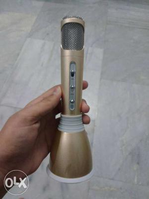 Mic with connected speaker.