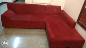 Red L- shape sofa