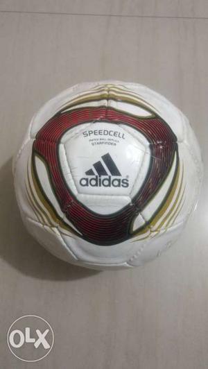 White And Red Adidas Soccer Ball