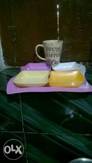 4 melamine cups and a tray and a coffee mug all