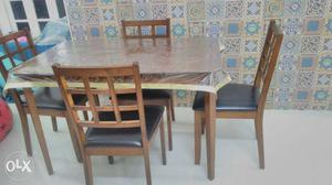 4 seater wooden dining table. V. Good condition.