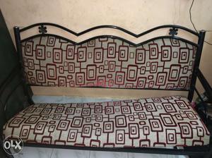 Black Metal Framed White And Red Padded Bench