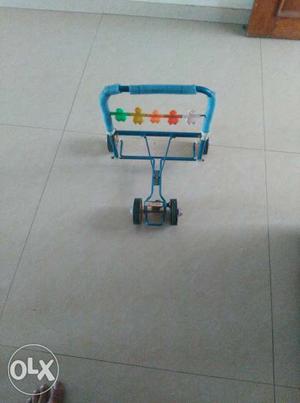 Blue And Green Wheeled Trolley