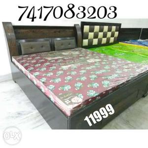 Brown Wooden Bed Frame With Red Floral Mattress