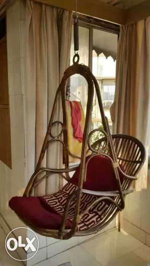 Brown Wooden Frame Red Padded Hanging Swing Chair