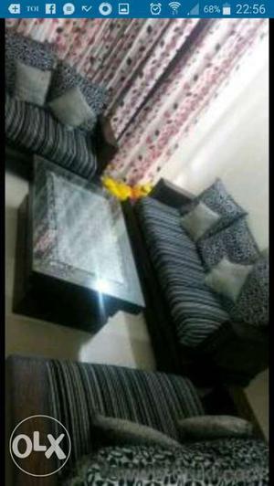Gently used 7 seater sofa set with center table