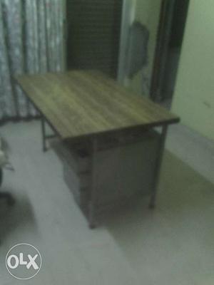 Large wooden table with 3 racks for storage,