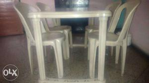 Multi purpose table with four chairs in