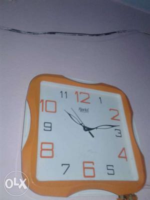 Orange And White Wall Clock