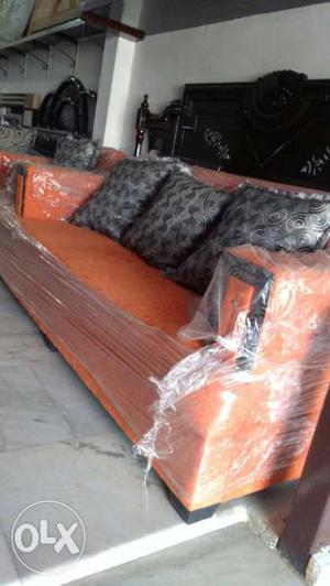 Orange Suede Sofa With Throw Pillows