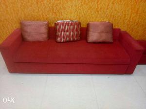 Red Cushion Couch And Throw Pillows