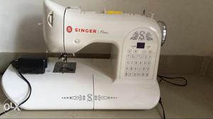 SINGER One sewing machine, 2 years old, looks