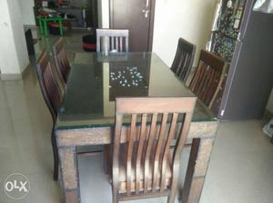 Teak wood dining table with 6 chairs