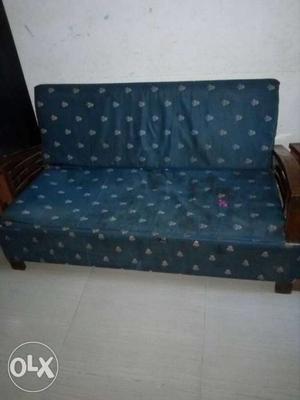 Teal Floral Print Futon With Brown Wooden Frame