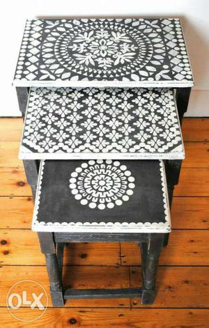 Three White-and-black Floral Nesting Tables