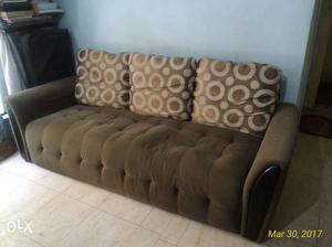 Three seater solid wood couch, two years old in maintained