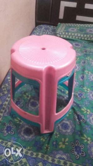 Two Pink And Teal Plastic Chairs