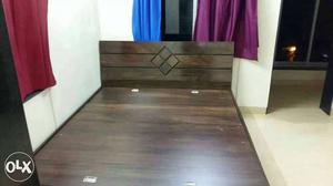 Wooden bed at low price available