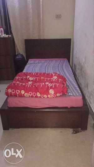 Wooden single bed with storage. very good condition.