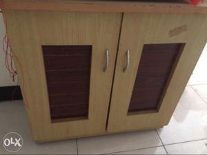 Wooden storage cabinet in new condition