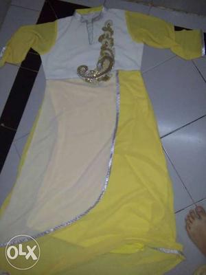 A yellow and white colour kurti with a beautiful