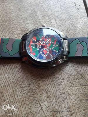Black Round Chronograph Watch With Green And Blue Strap