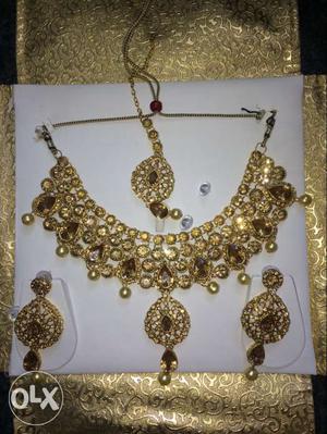 Brand new necklace set along with packing. brs
