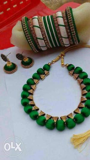 Green Necklace, Jhumka Earrings, And Silk Thread Bangle Set