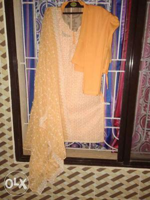 Orange And white colored salwar suit