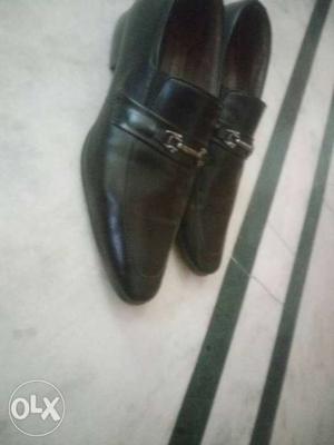 Pair Of Black Leather Slip On Dress Shoes