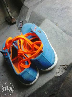 Pair Of Blue And Orange Sneakers