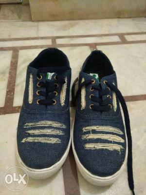 Pair Of Blue And White Shoes