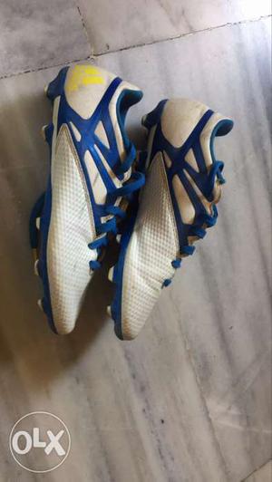 Pair Of White-and-blue Cleats
