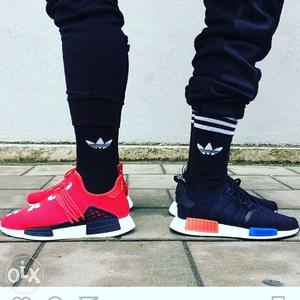Two Pairs Of Red And Blue Adidas Sneakers