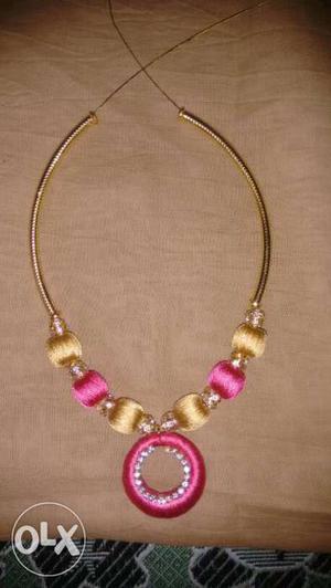 Yellow And Pink Silky Thread Round Pendant Necklace