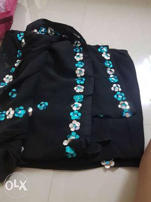 Black, Teal, And White Beaded Cloth