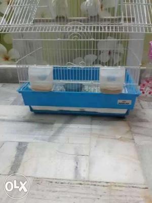 Cage with food and birds