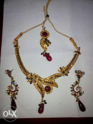 Gold, Ruby, And Emerald Floral Necklace And Earring Set