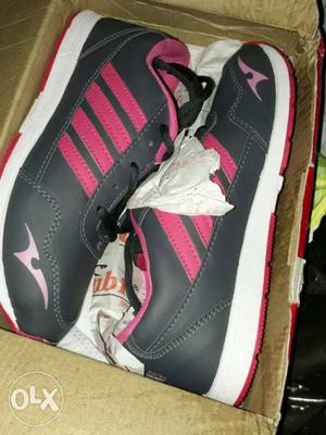 Pair Of Black-and-pink Sneakers In Box