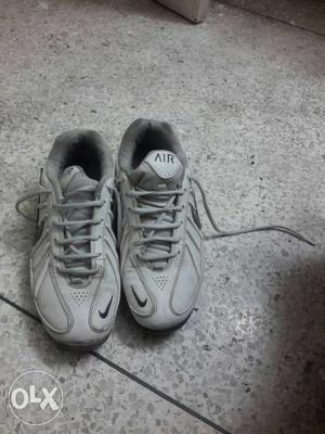 Pair Of Gray Nike Air Basketball Shoes