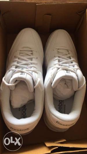 Pair Of White Reebok Sneakers