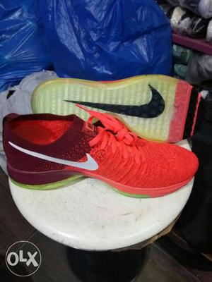 Red-and-maroon Nike Running Shoes